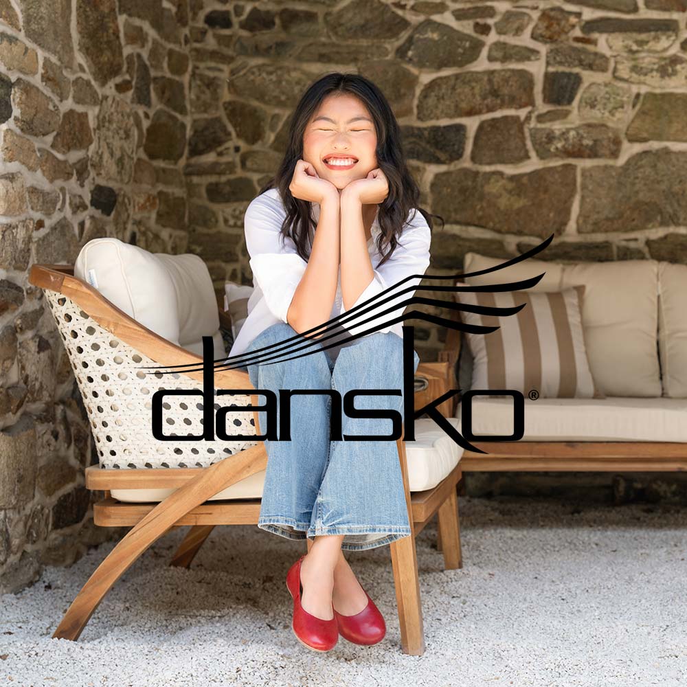 danksko featured brand lifestyle image with lady sat on armchair